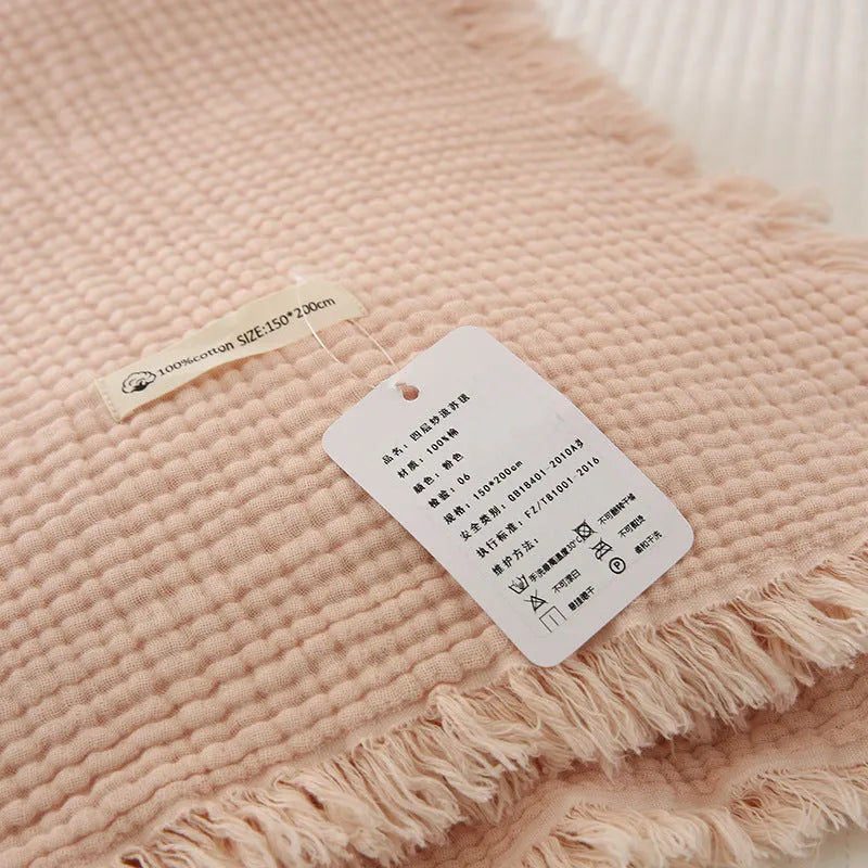 Four-layer gauze cotton blanket with tassel detailing in avocado green colour