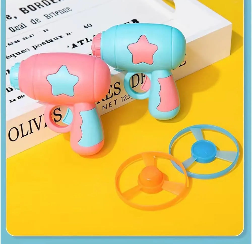 Blue and pink plastic cat toy gun with two frisbees for indoor play