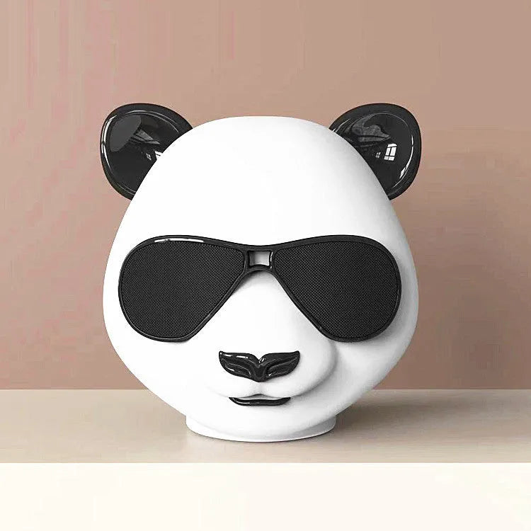 Classic style portable mini Bluetooth speaker showing front grille and compact design.