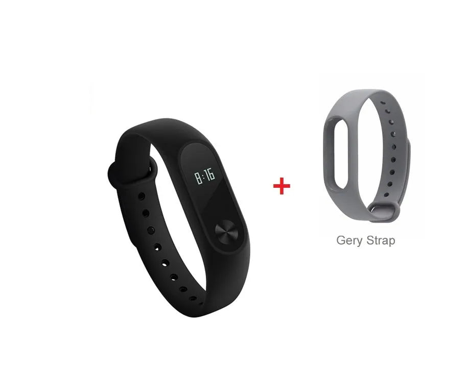 Xiaomi Mi Band 2 black smartband on wrist showing OLED display with heart rate and step count.