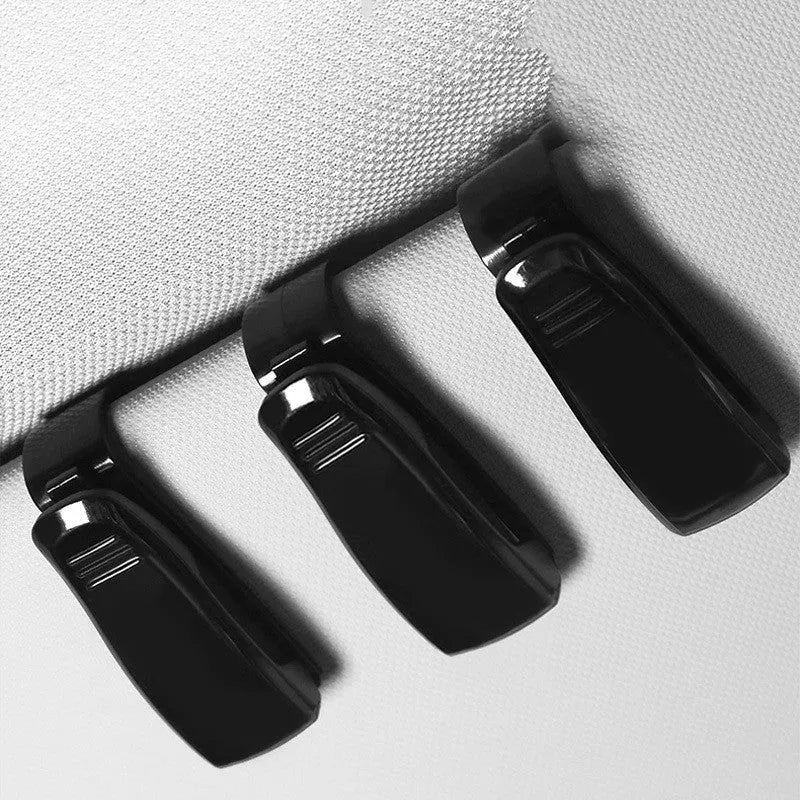 Black plastic car sunshade clip for holding glasses, tickets and ID cards