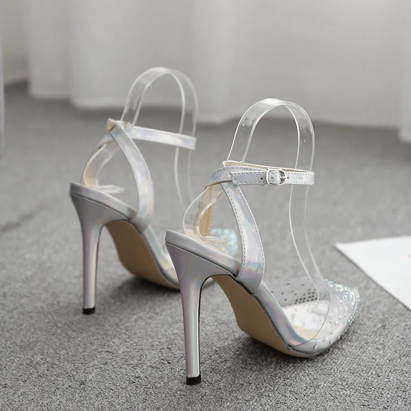 Women's pointed toe diamond sandals with stiletto heel on a white background.