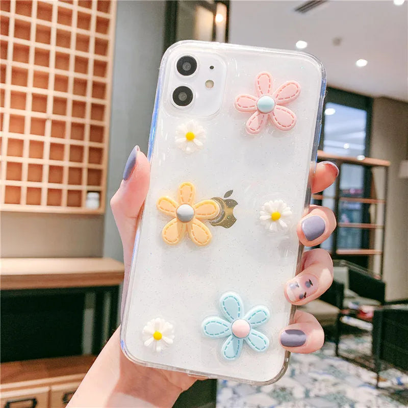 Soft rubber iPhone case with embossed floral pattern and heart design on a white background.