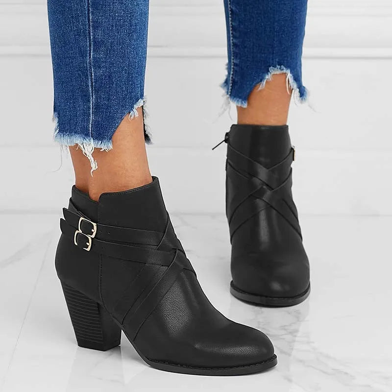Plus size black short boots with a side zipper, buckle, and a 7cm stout heel on a rubber sole.