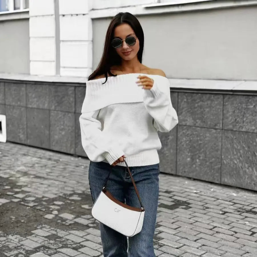 Woman wearing a grey off-the-shoulder strapless sweater with a 3D textured pattern.