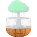 White cloud-shaped humidifier with LED lights and water vapour emission