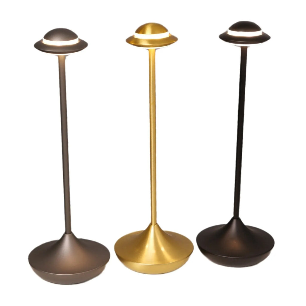 UFO-shaped rechargeable table lamp with touch controls in metallic finish