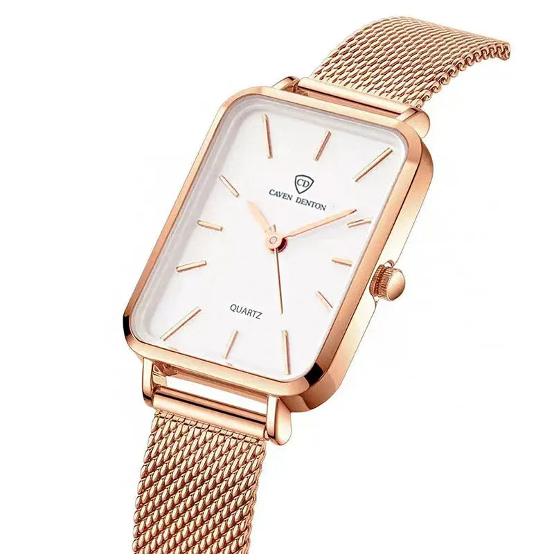 Women's rose gold waterproof quartz watch with woven steel band on wrist.
