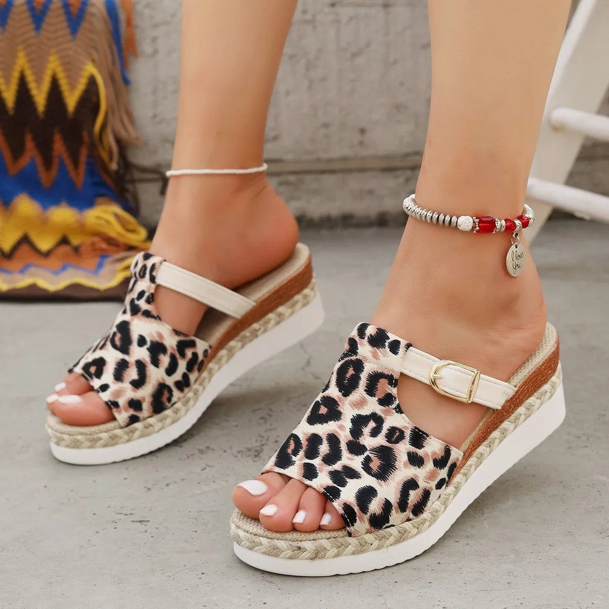 Leopard print wedge platform sandals with a fish mouth toe on a rubber sole.