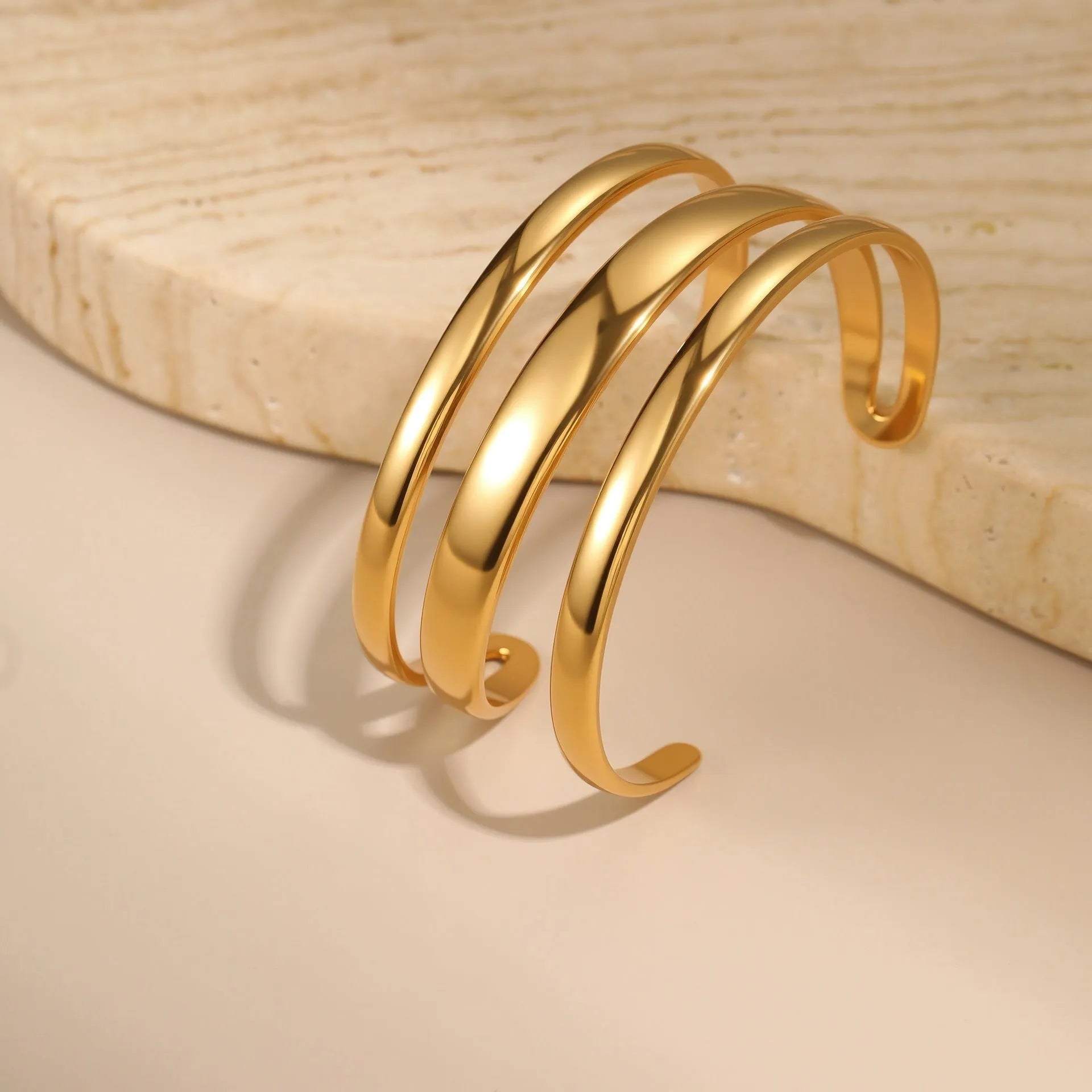 Stainless steel geometric opening bracelet with 18K electroplating in gold or steel colour