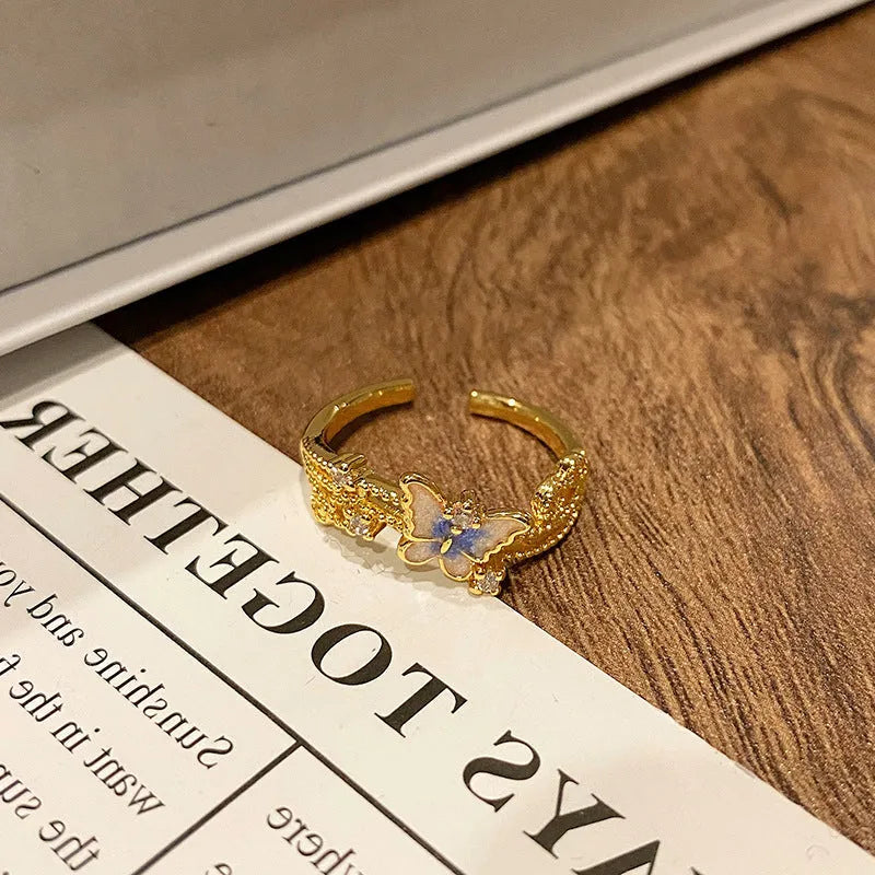 Butterfly design copper ring with oil-drip textured finish in women's jewellery