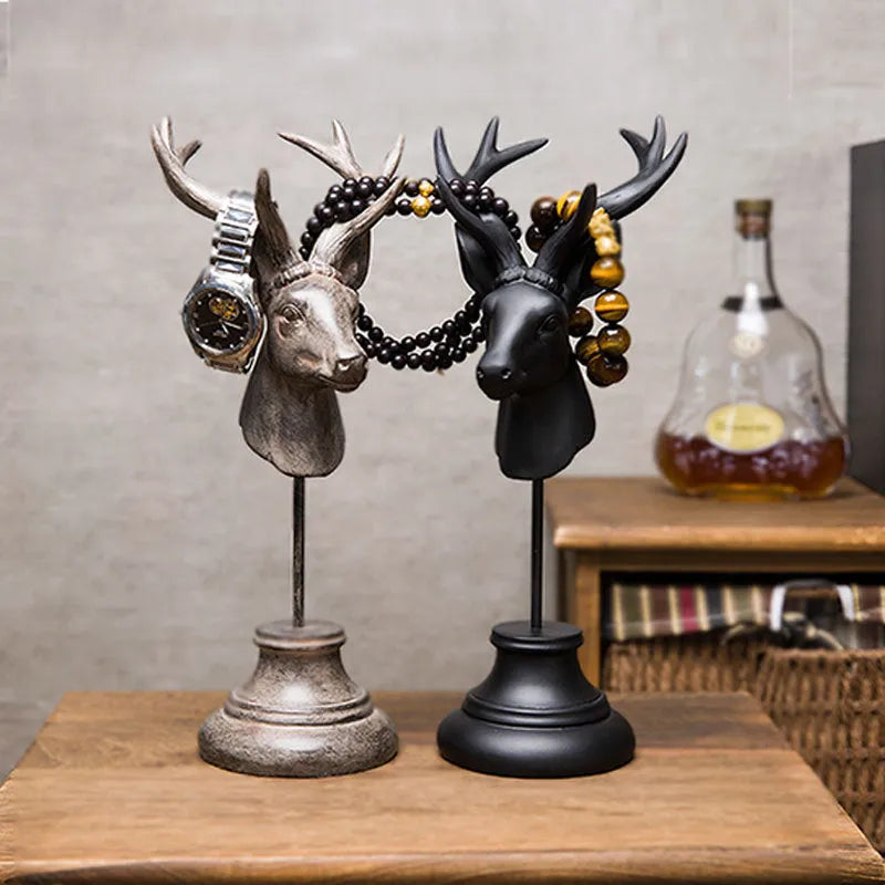 Natural resin decorative animal sculpture in black, white, or wood colour on a wooden table.