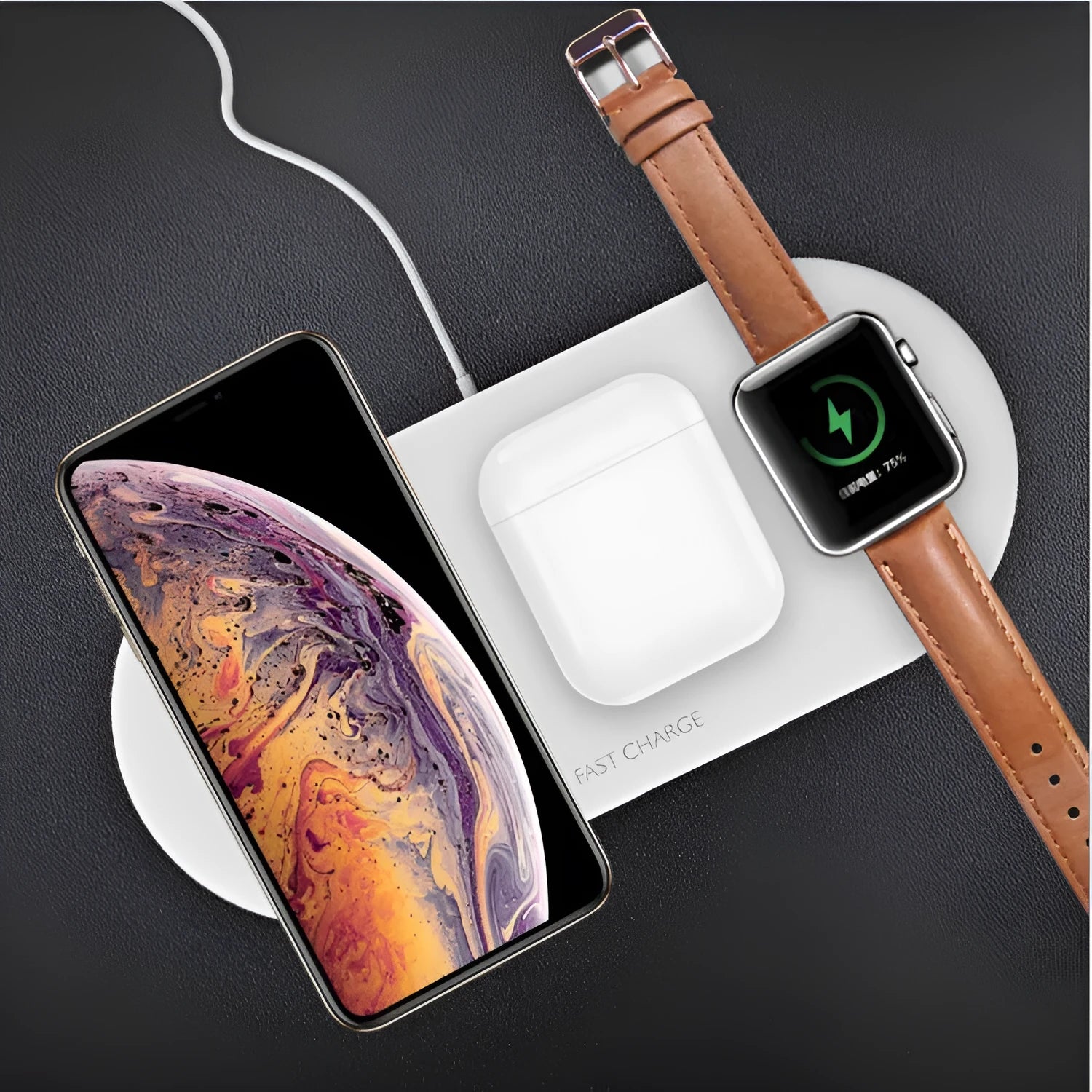 Black 3-in-1 wireless charging station for Apple Watch, phone, and headphones on a desk.