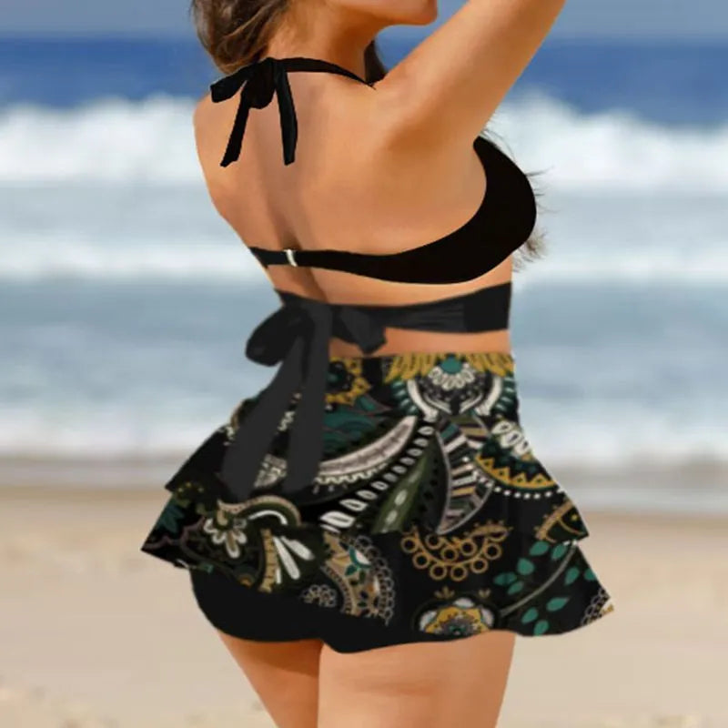 Women's purple bikini set with lace-up design featuring sleeveless top and high-waist split skirt