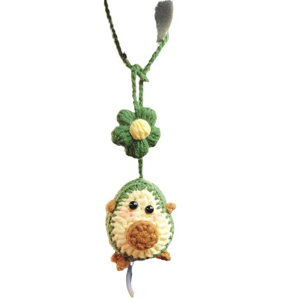 Handmade crocheted wool car pendant with rainbow colours hanging from car mirror