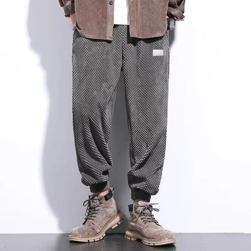 Grey men's straight-leg sweatpants with an ankle tie fastening on the hem.