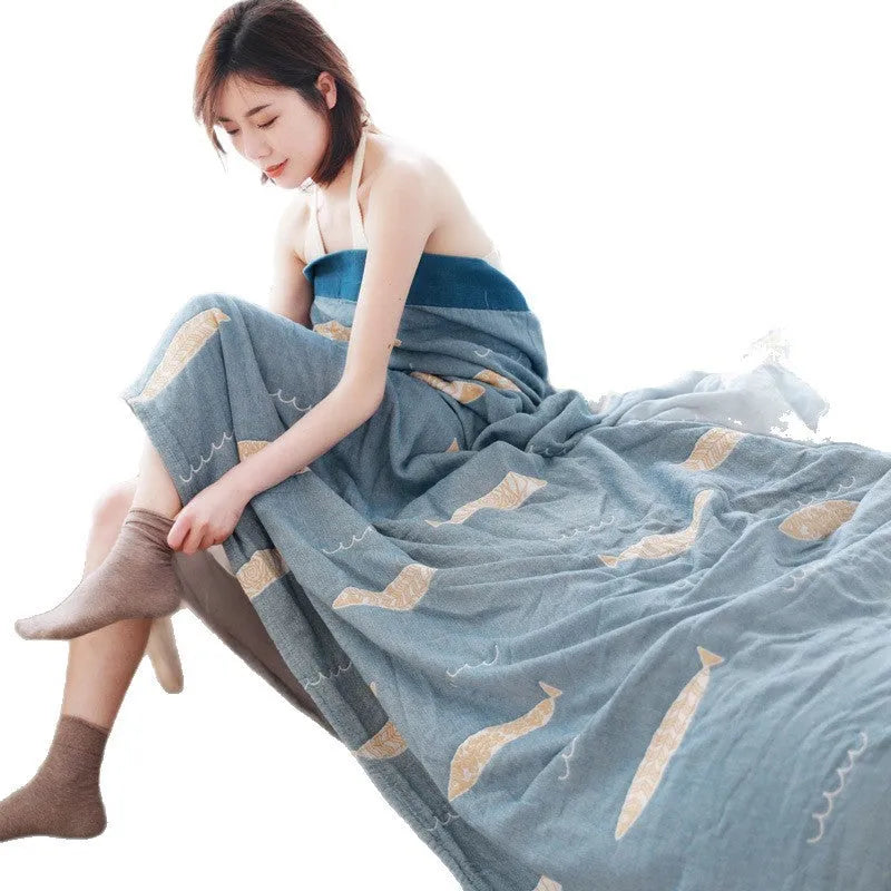 Blue five-layer gauze pure cotton blanket folded to show texture and modern printed pattern.