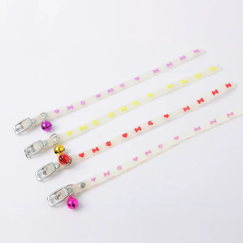 Glow in the dark cat collar with adjustable silicone chain and metal bell in paw print design