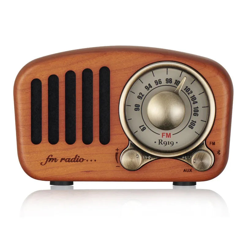 Retro wooden wireless mini speaker in cherry wood finish showing front and side.