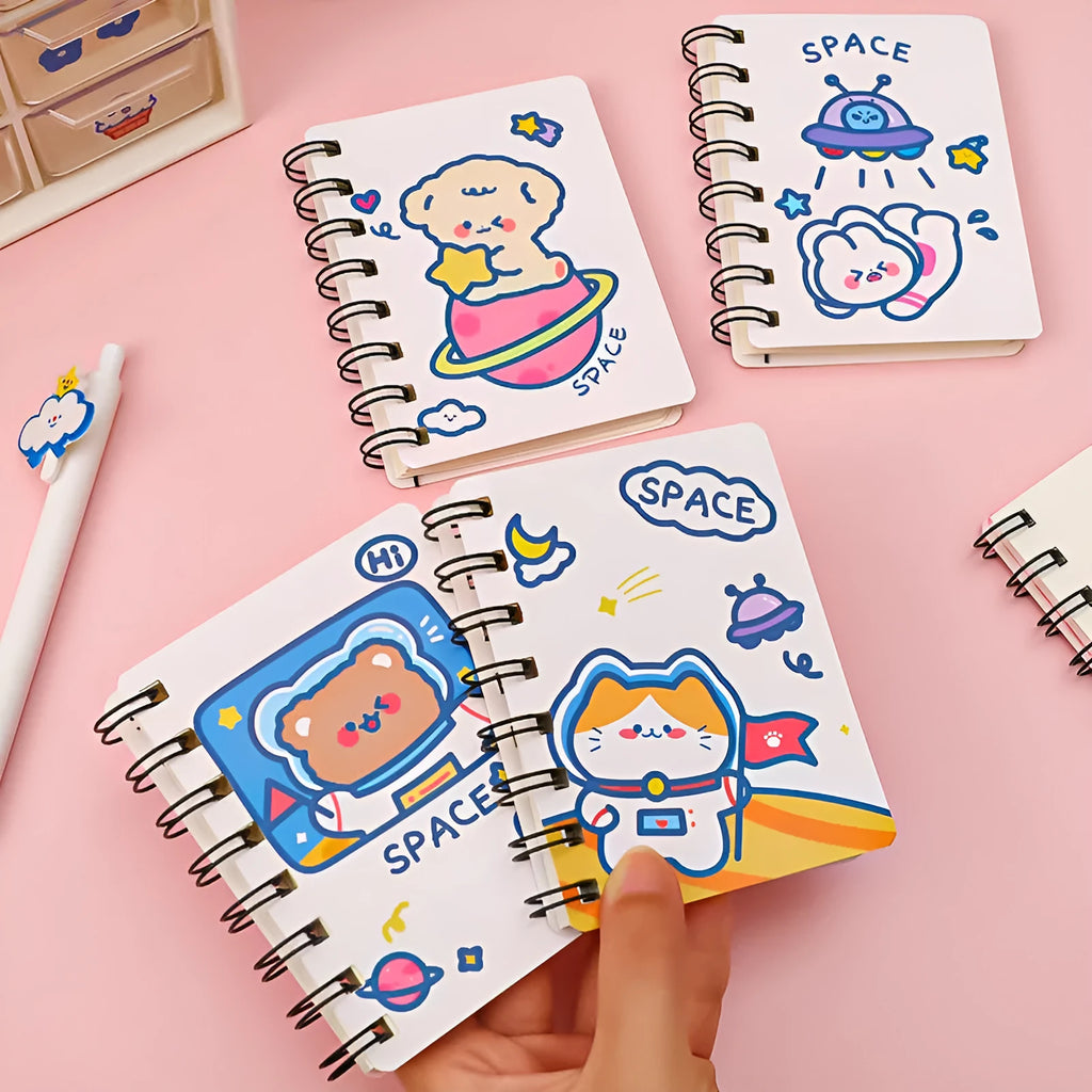 Astronaut themed flipper notebook showing compact 10.5cm by 8cm size with space artwork cover