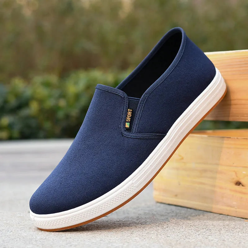 Men's black canvas slip-on shoes with round toe and low-top design