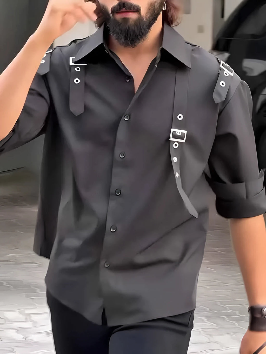 A man's black utility-style button-up shirt with a regular fit, laid flat.