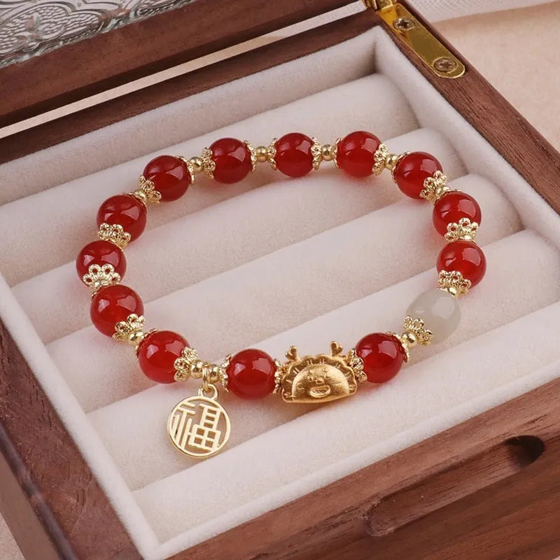 Glass floral glazed bracelet with zodiac animal charm in red, pink, and white pearl bead colours