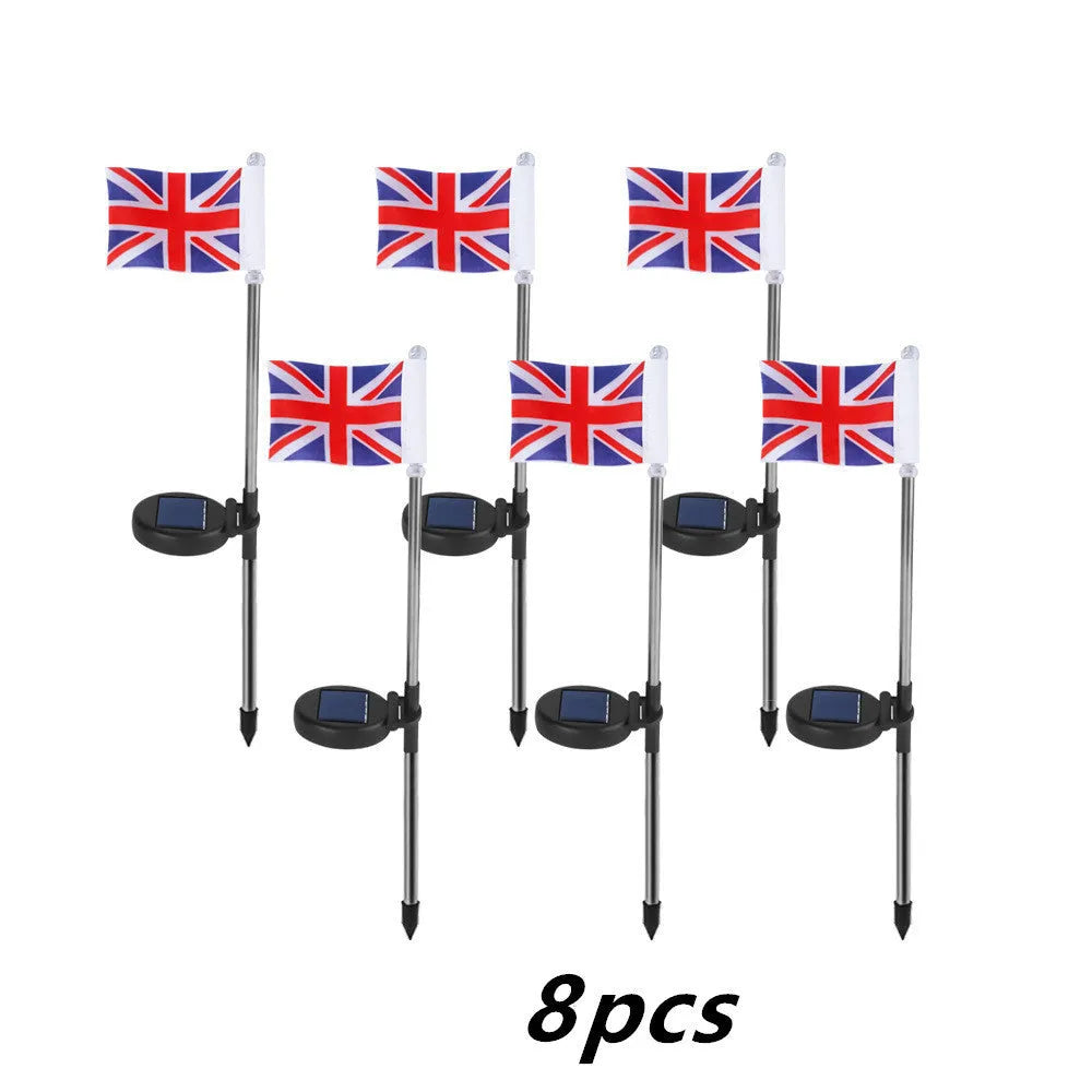 Solar garden flag light with stainless steel pole showing American flag design illuminated at night