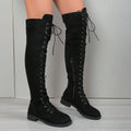 Black lace-up over-the-knee boots with round toe and flat heel on a neutral background.