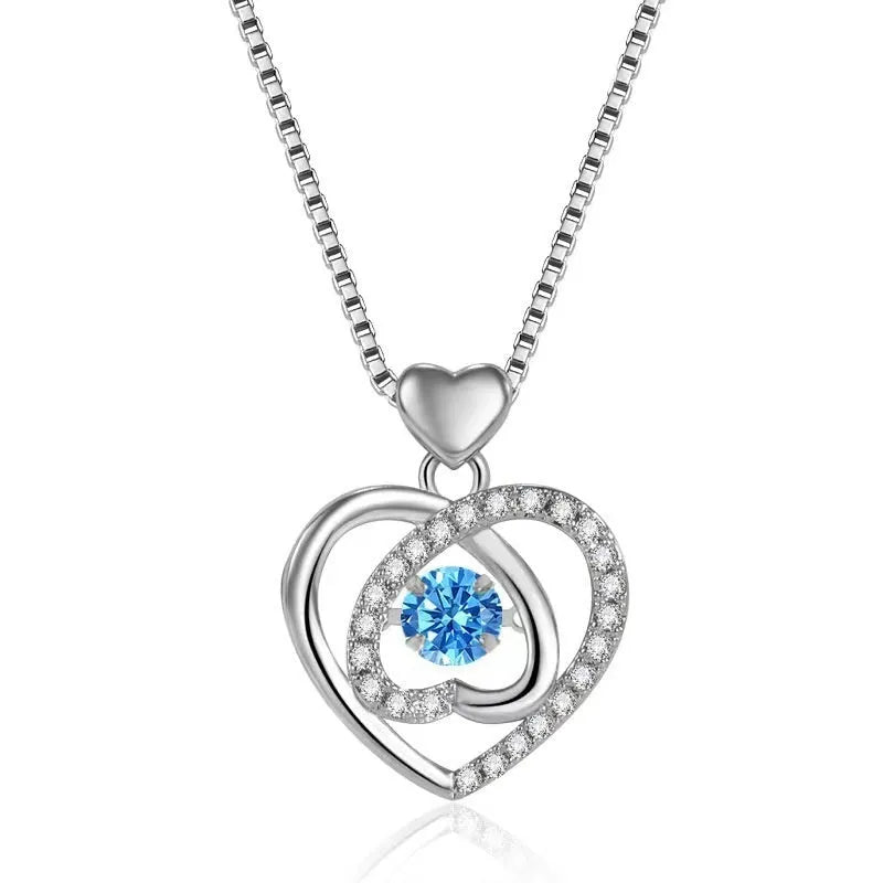 Blue diamond heart pendant necklace and matching bracelet jewellery set on copper