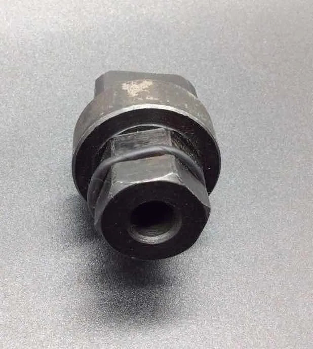 Aodi T40058 crankshaft rotating sleeve and adapter tool for Audi engine timing service.