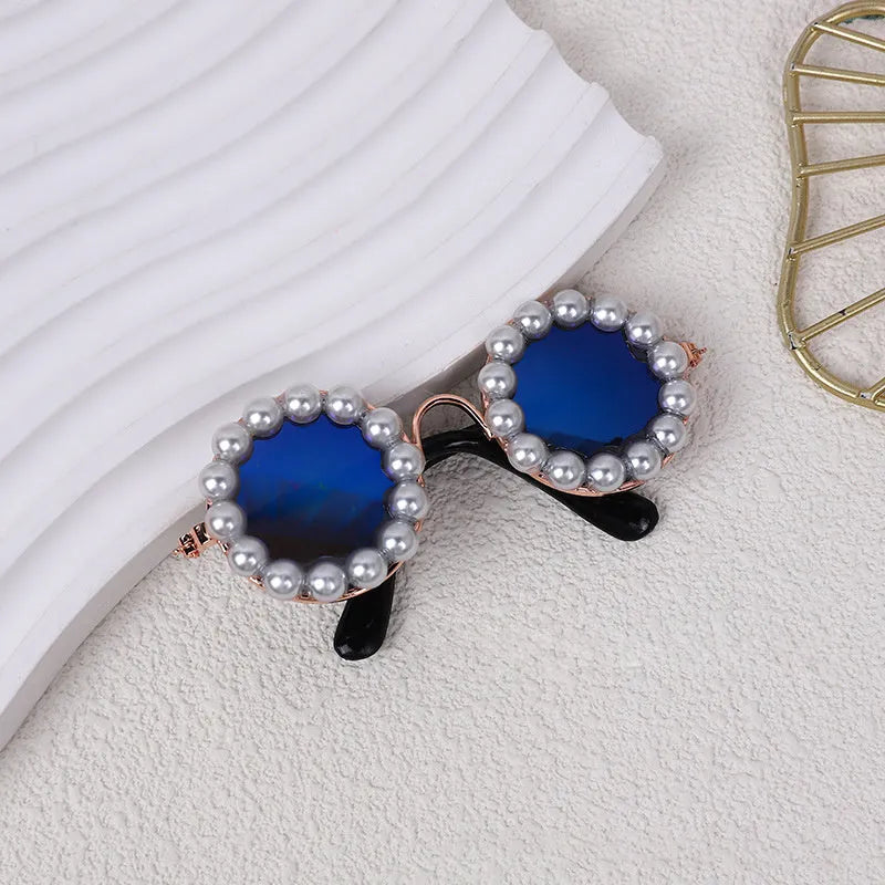 Pearl-rimmed round sunglasses for cats and dogs in multiple colours as costume accessories