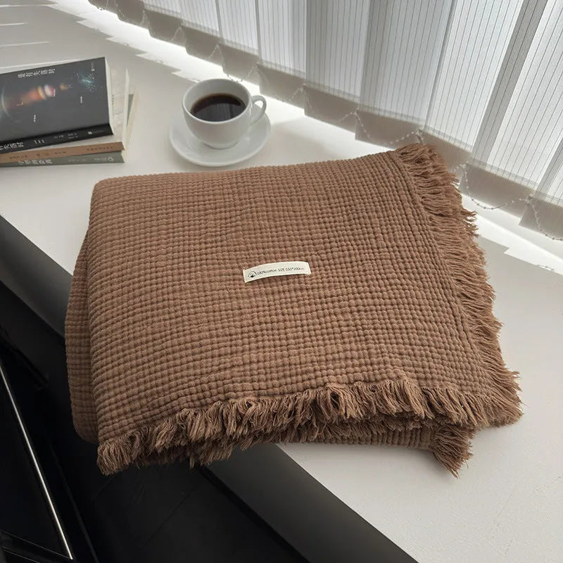 Four-layer gauze cotton blanket with tassel detailing in avocado green colour