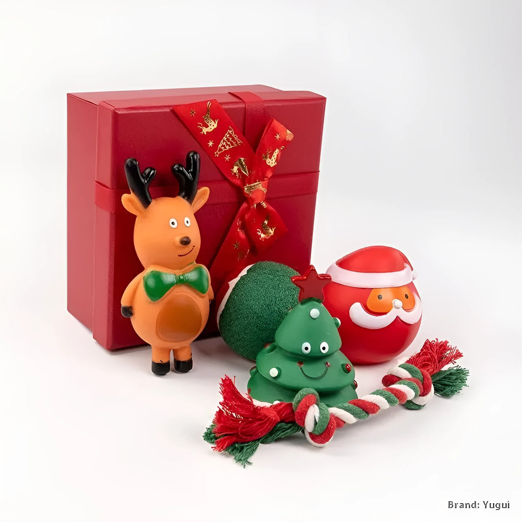 Christmas-themed vinyl dog chew toy set including barbells, balls, ropes, and festive figures in gift packaging.