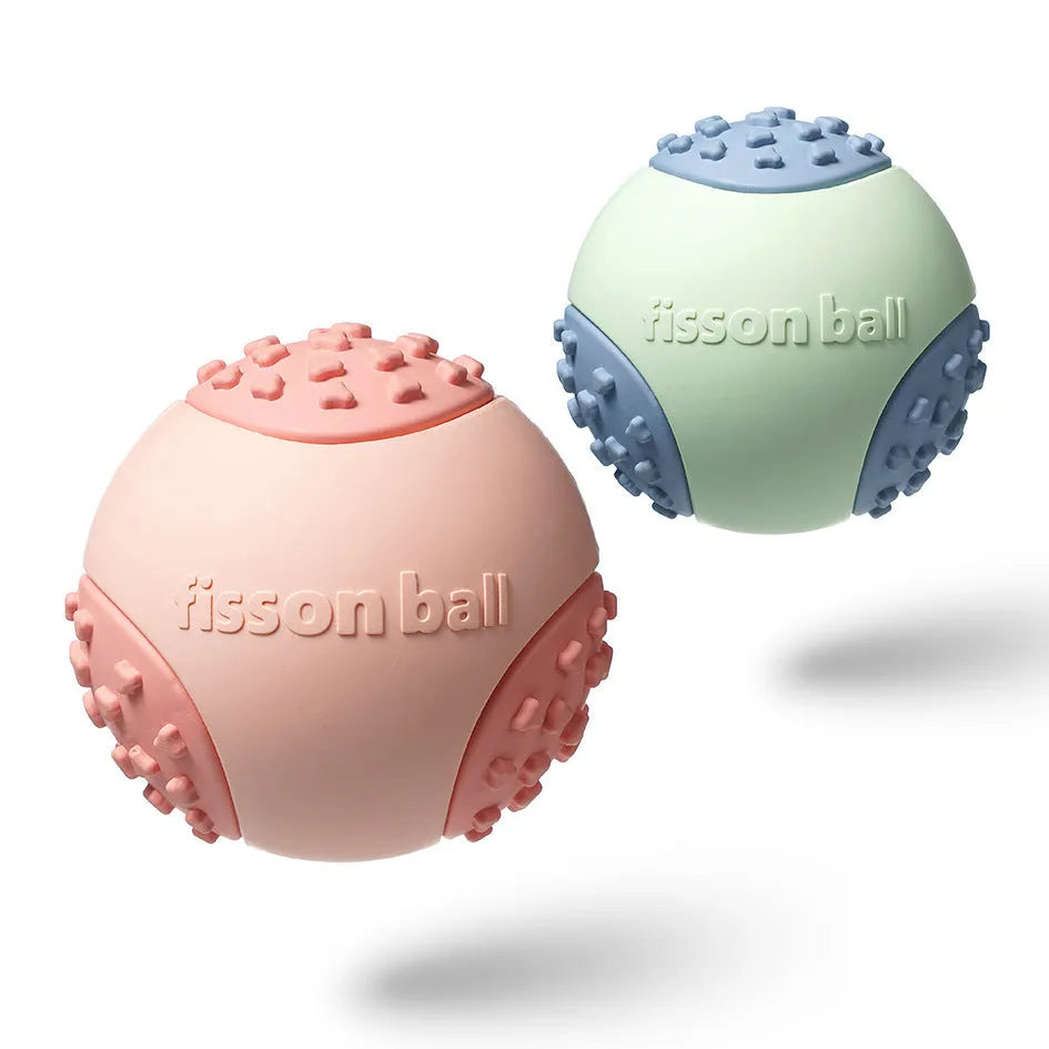 Green and pink rolling ball dog toy for small medium sized dogs