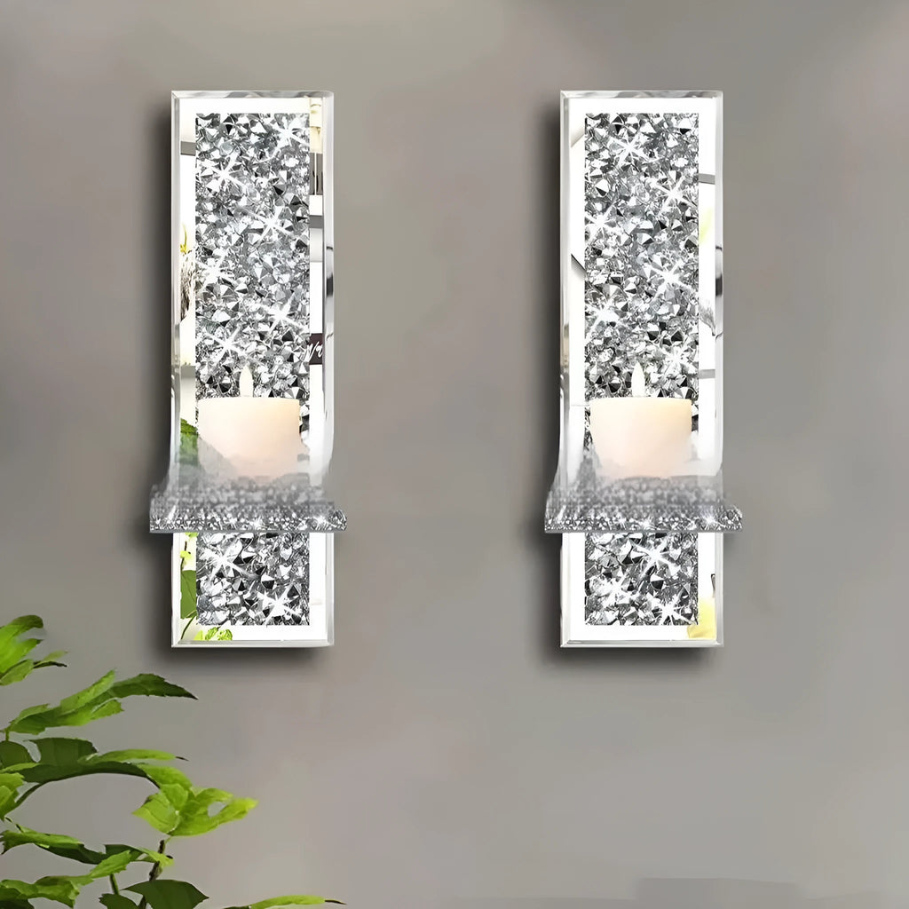 Pair of silver mirror glass wall hanging candle holders measuring 38cm tall.