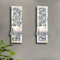 Pair of silver mirror glass wall hanging candle holders measuring 38cm tall.
