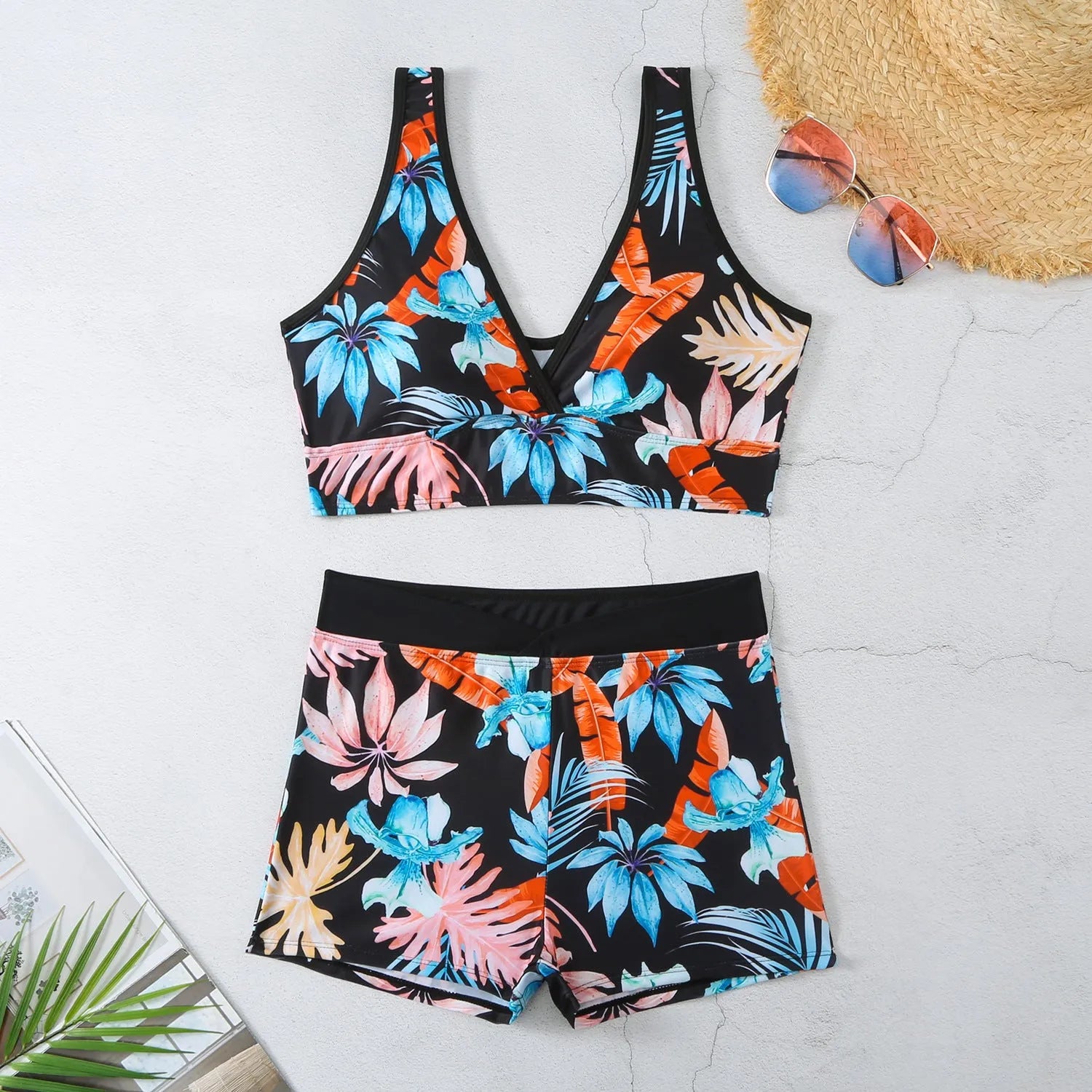 Women's two-piece swimsuit set with sleeveless top and printed boxer-style briefs in multiple colours.