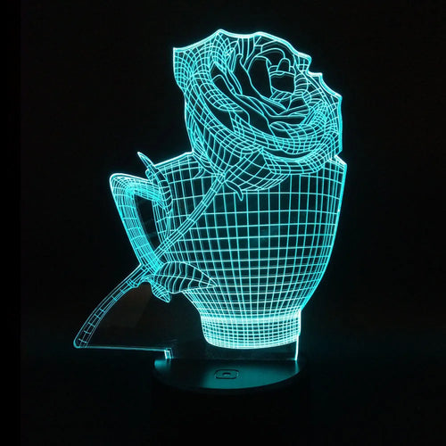 3D acrylic rose flower LED night light with remote control on a dark surface, showing colourful illumination.