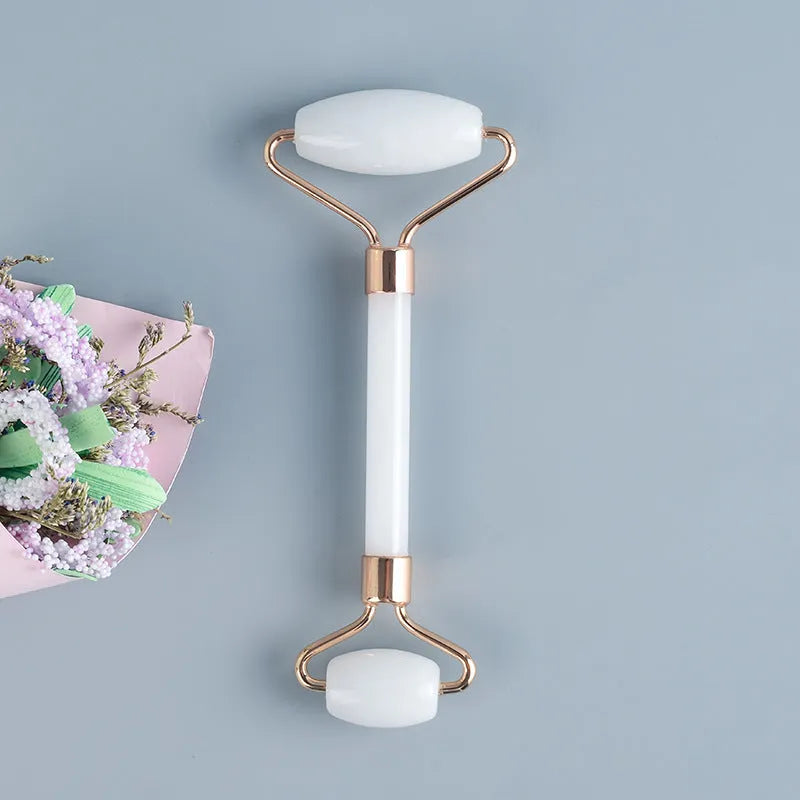 White jade double-headed facial roller and optional wooden gua sha scraping board.