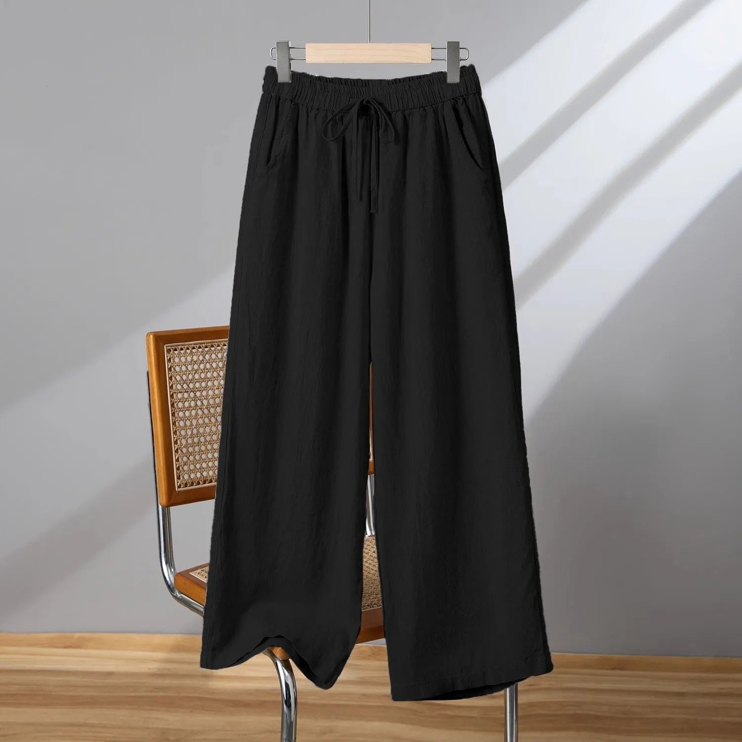 Women's straight-leg casual trousers in apricot colour with elastic waist and lace-up drawstring detail