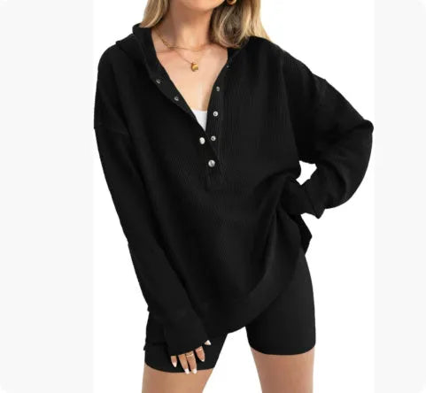 Women's loose raglan sleeve pullover sweater in peacock green colour, laid flat.