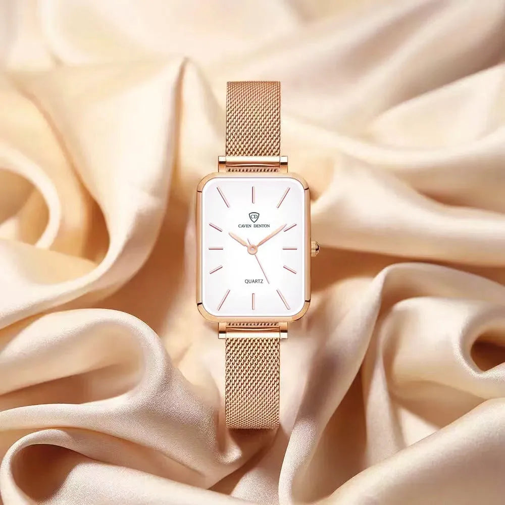 Women's rose gold waterproof quartz watch with woven steel band on wrist.