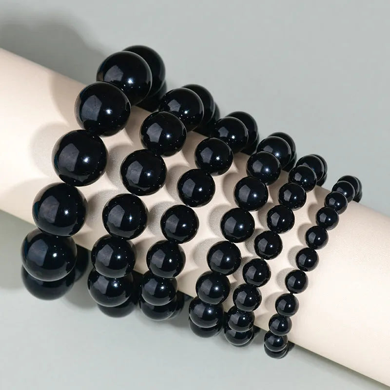 Hand-woven obsidian bracelet with round crystal beads in multiple colour options