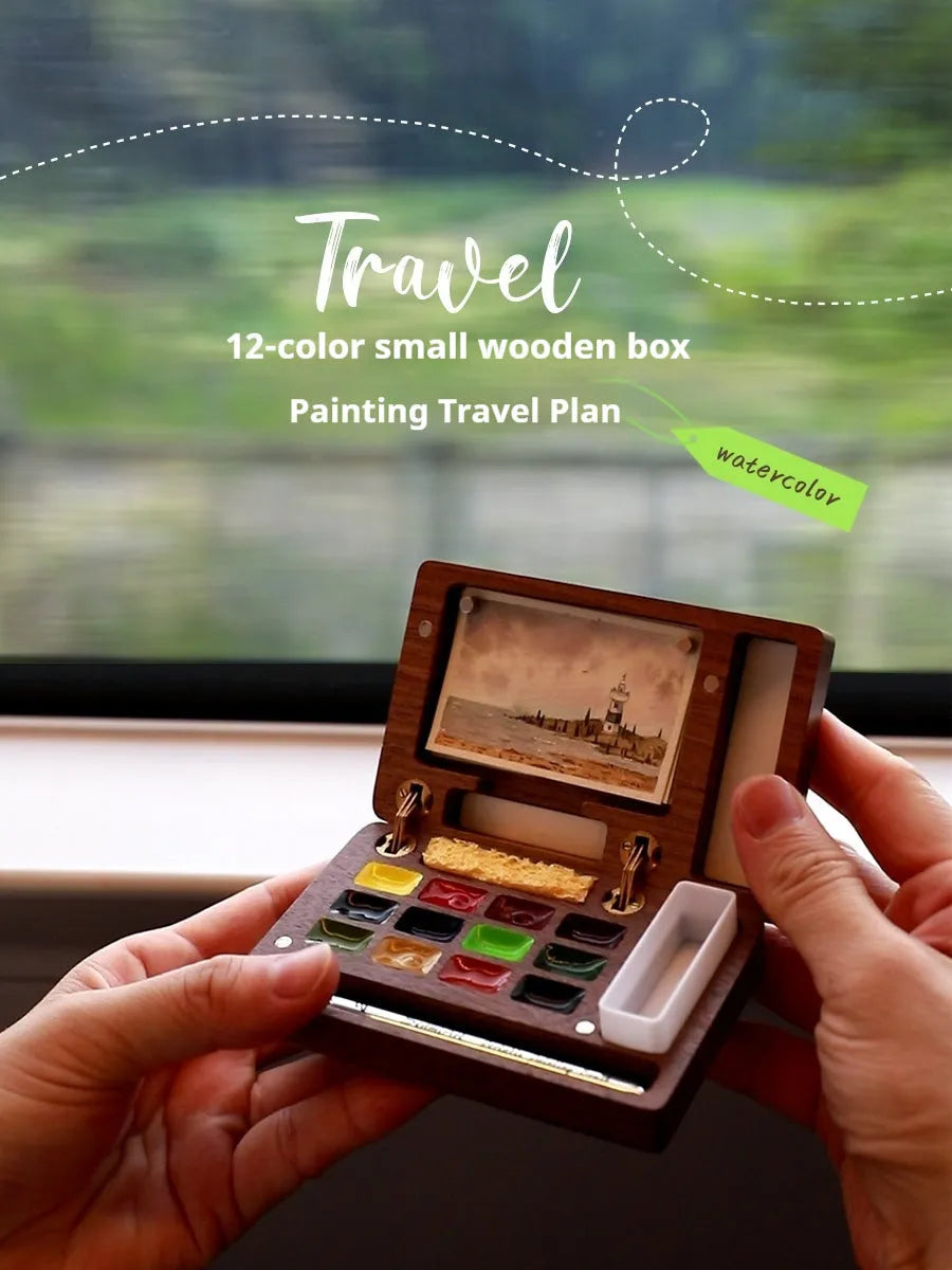 Mini wooden watercolour paint box with pigment suit inside, closed lid showing walnut-colour finish