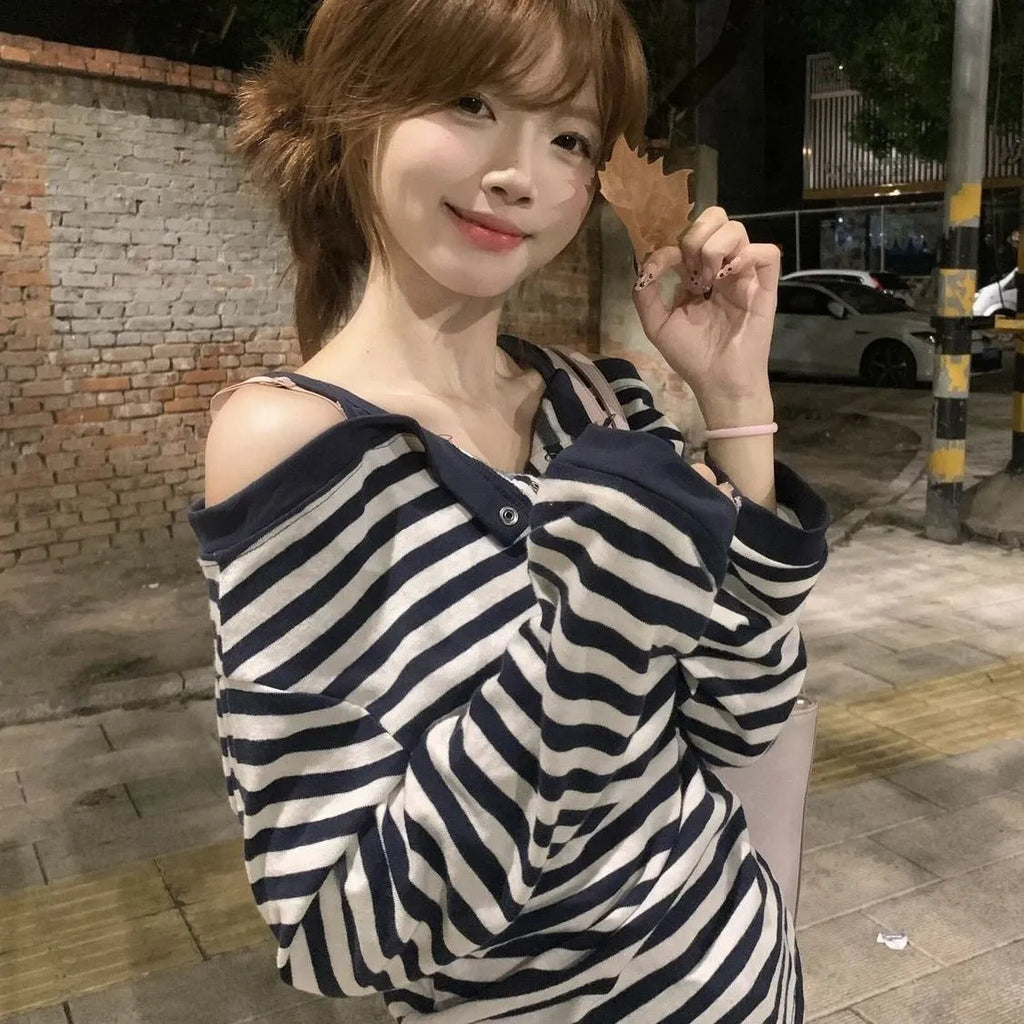 Dark blue Korean-style oversized women's t-shirt with embroidery and stripe details on long sleeves