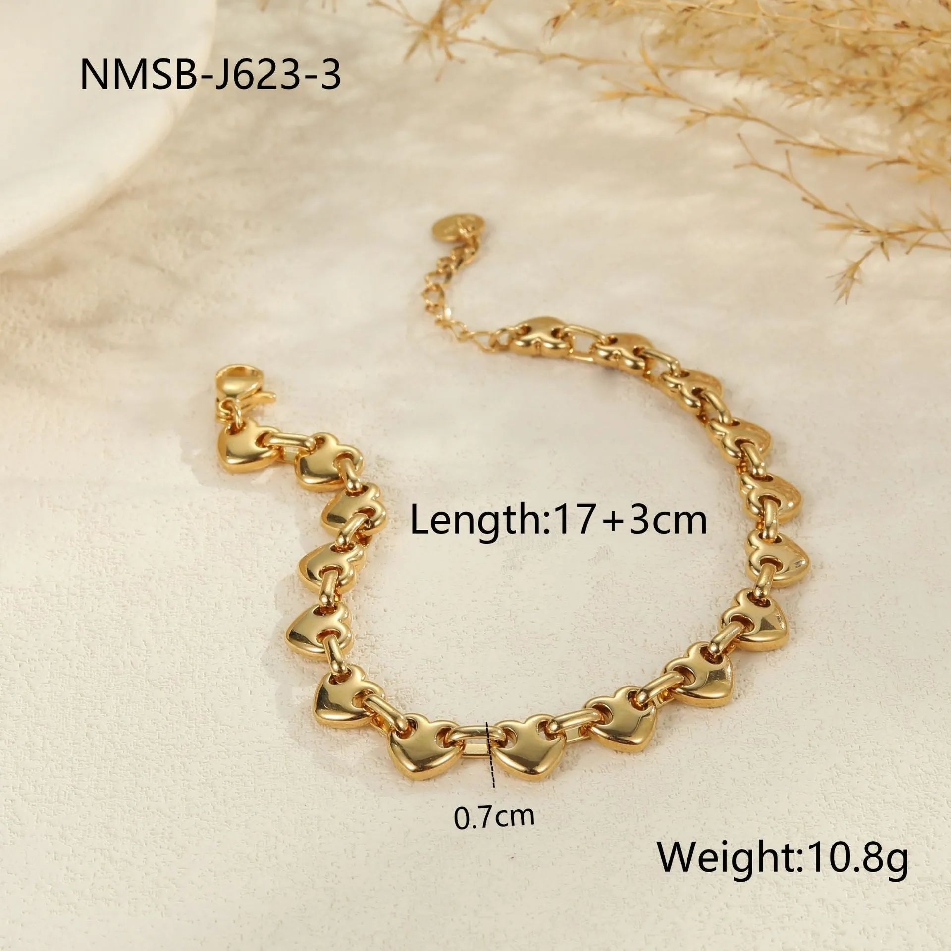 Women's geometric hollowed-out heart bracelet in stainless steel, available in gold or steel colour.