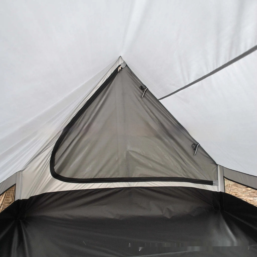 Brown or white A-line cabin tent pitched with trekking poles, showing spacious interior and waterproof fabric construction