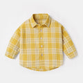 Boys' cotton lattice shirt with animal cartoon pattern in light blue, showing long sleeves and casual style.