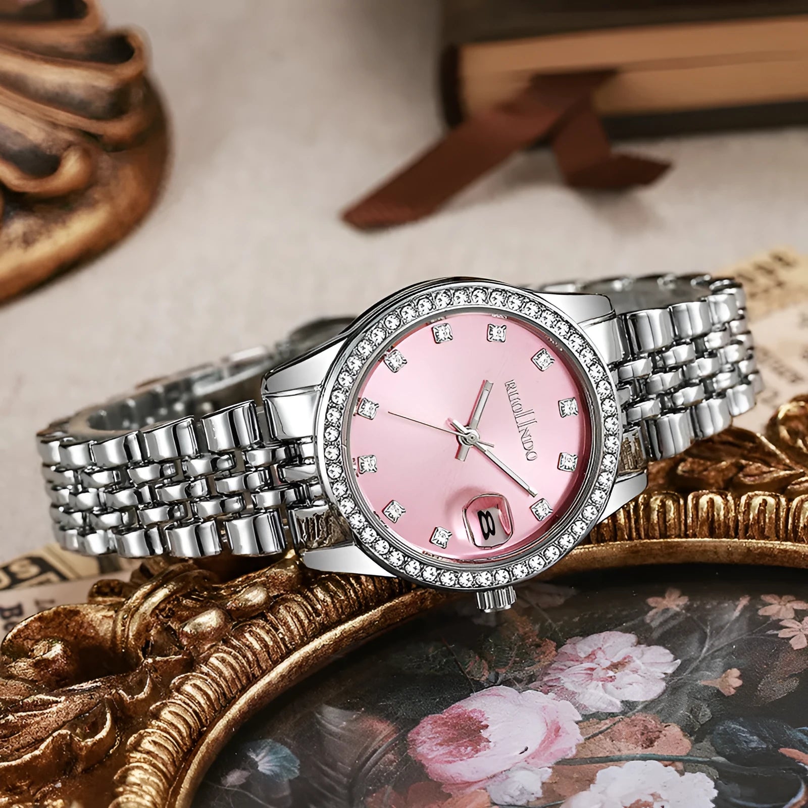 Women's silver alloy fashion watch with circular dial and stainless steel buckle on wrist.